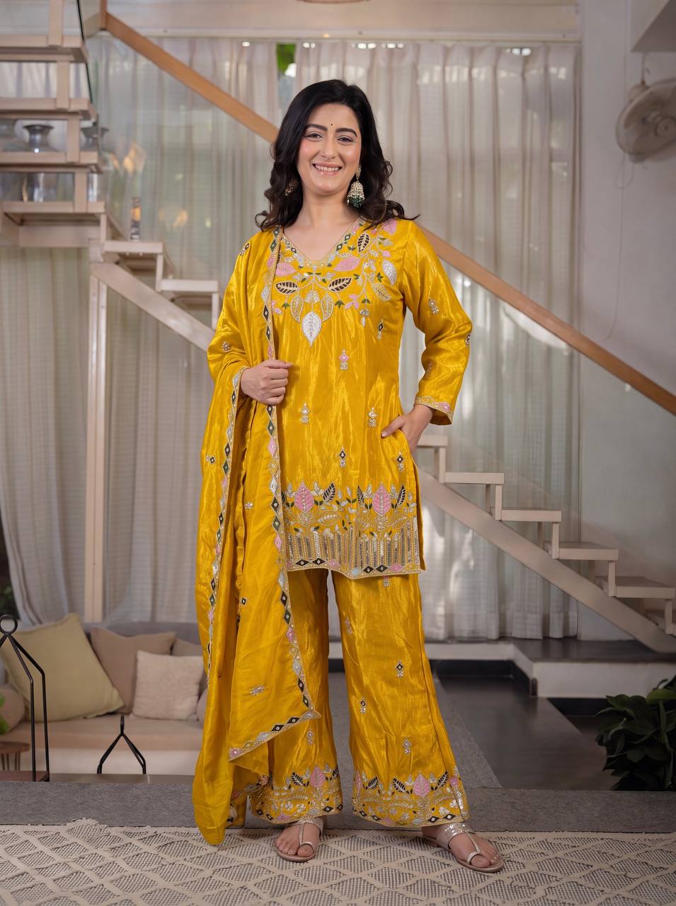 Elegant Rust Orange Silk Kurta and Flared Palazzo Set Adorned with Intricate Multicolored Botanical Embroidery and Mirror Work